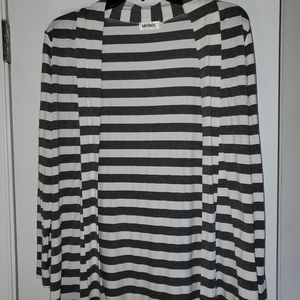 Gray and white striped with brown elbow patches. Small from Pintrest.